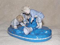 anchor-mark-query-boys-playing-marbles-figurine-21515130.jpg