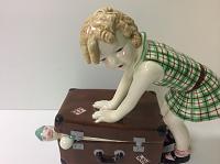 art-deco-figure-girl-with-suitcase-by-goldscheider.jpg